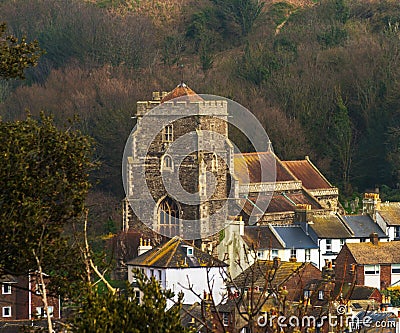 Old church and roofs of buildings covered with green moss, seasi Stock Photo