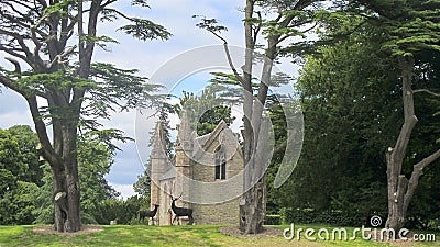 Old church in scotland with silhouetted deer figures Editorial Stock Photo