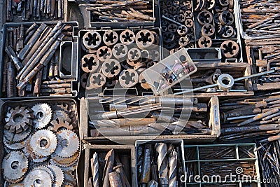 old circles on the saw. close-up showing old rusty metal and brass parts in bulk for decoration Stock Photo