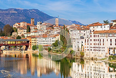 Old city mirroring in the river Stock Photo