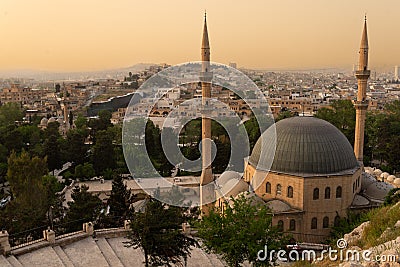 Old city of Sanliurfa, Turkey. Mevlidi Halil Cami mosque and minarets at dusk. Stock Photo