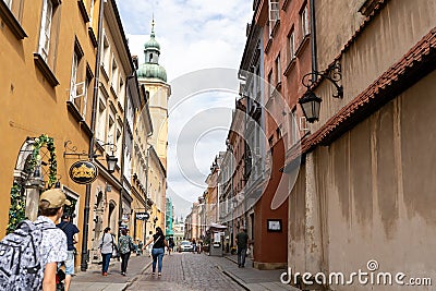 Old city. Warsaw Poland. Multicolored houses. Street with tourists. Warsaw, Poland - August 1, 2023. Editorial Stock Photo