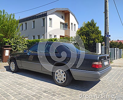 Old classic big luxury coupe car Mercedes Benz E 320 E 320 left side parked Editorial Stock Photo