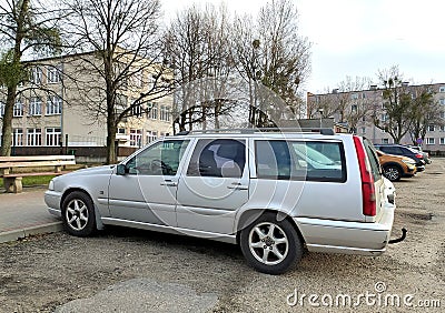 Old classic Swedish veteran big estate station wagon car silver grey Volvo 850 parked Editorial Stock Photo