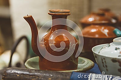 Old clay jug in antique shop in China Stock Photo