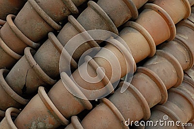 Old clay pots in layers. Traditional gardening tool Stock Photo