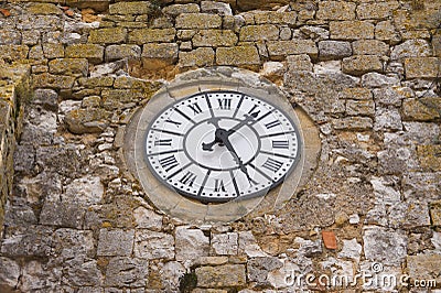 Old clock on medieval church Stock Photo