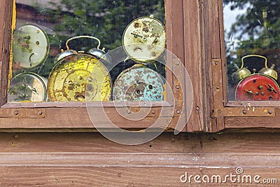 Old clocks in the window Stock Photo