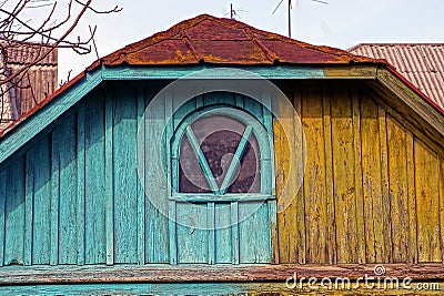 Old colored wooden loft with a small window Stock Photo