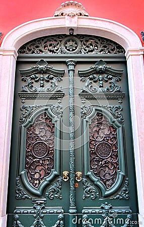 Old and colorful carved wood door with iron details Stock Photo