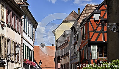 Colorful half-timbered houses with storks nest. Stock Photo