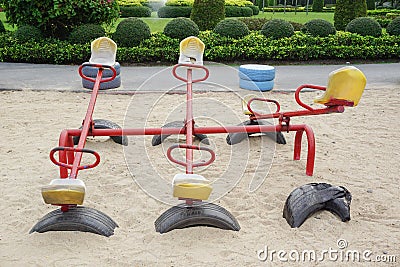 Old colorful seesaw Stock Photo