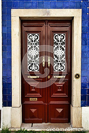 Old and colorful wooden door with iron details Stock Photo