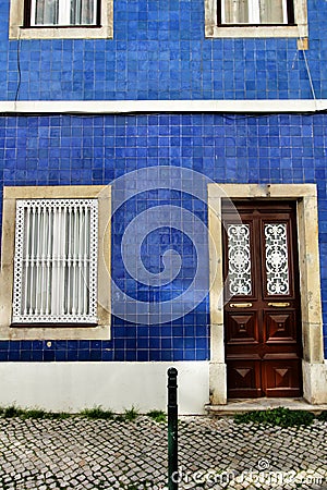 Old and colorful wooden door with iron details Stock Photo