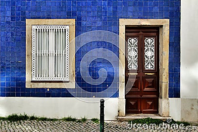 Old and colorful wooden door with iron details Stock Photo