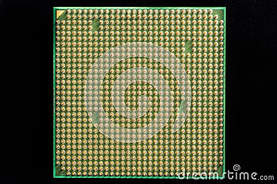 Old computer processor with gilt legs isolated on black background Stock Photo