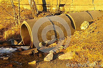 Old concrete drainpipe Stock Photo