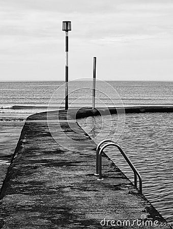 Old concrete lido or sea water swimming pool Stock Photo