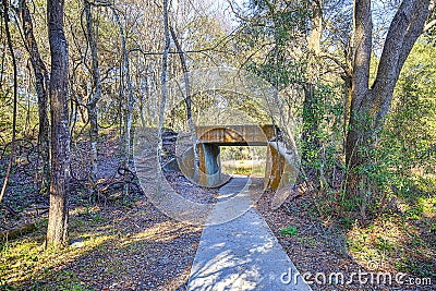 Old Concrete Railway Trestle With Paved Walking Path Stock Photo