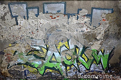 An old concrete wall with boneless plaster, spoiled by colored graffiti drawing Editorial Stock Photo