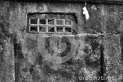 Old concrete wall with small windows Stock Photo
