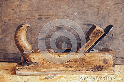 Old construction tools on a wooden workbench flat lay background with copy space. Old woodworking hand tool Stock Photo