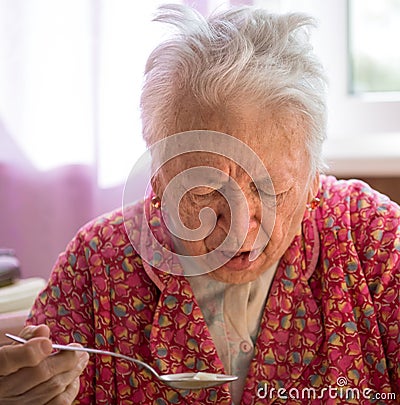 Old coughing woman Stock Photo