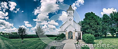 Old country church with cornfields Stock Photo