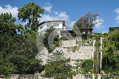 Old country house on steep coastline Stock Photo