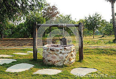 Old countryside water well. Stock Photo