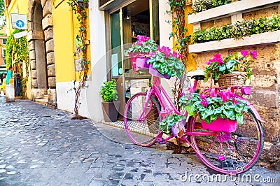 Old cozy street in Trastevere, Rome, Italy with a purple bicycle Stock Photo