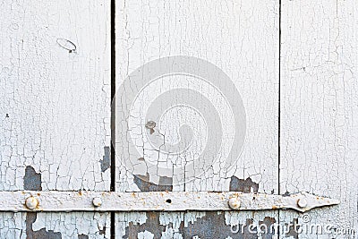 Old cracked paint pattern on the door with metal detail. Stock Photo