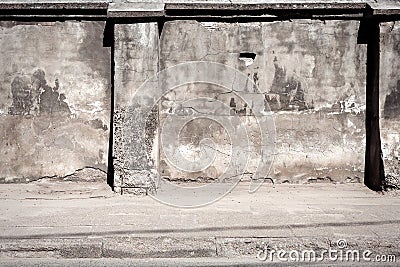 Old cracked plaster fence Stock Photo