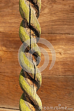 Old cracked spiral carved wooden column Stock Photo