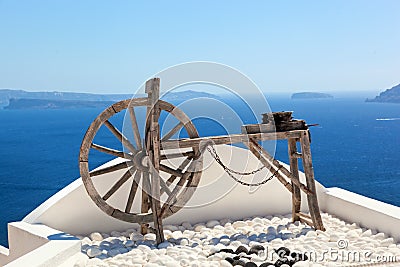 Old craftsmanship machine on the roof. Santorini island, Greece Stock Photo