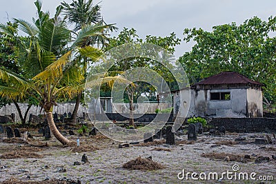 Old creepy burial ground with crypt and graves at the tropical local island Fenfushi Stock Photo