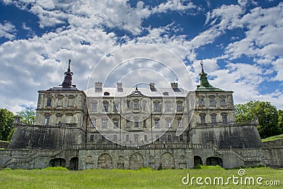 Old creepy dark castle under the blue sky Stock Photo