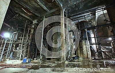 Old creepy, dark, decaying, destructive, dirty factory Stock Photo