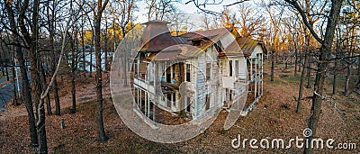 Old creepy wooden abandoned haunted mansion, aerial view Stock Photo