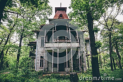 Old creepy wooden abandoned haunted mansion Stock Photo