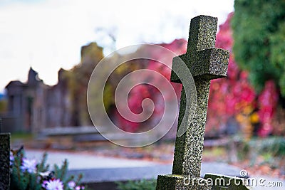 Old Cross in the Autumn Cemetery Stock Photo