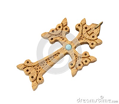 Old cross of carved wood decorated with turquoise Stock Photo
