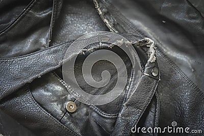 Old, crumpled and dirty leatherette bag, bag handles closeup, texture. Worn material with stains and crumbling surface Stock Photo