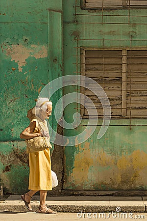 Old Cuban lady walking Havana Editorial Stock Photo