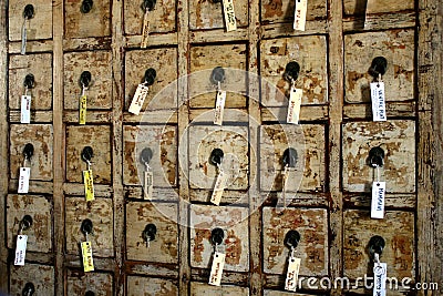 Old cupboard with trays and labels Stock Photo