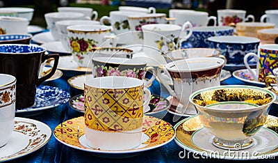 Old cups at flea market Stock Photo