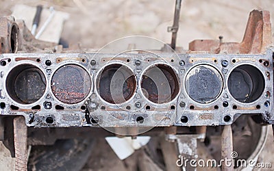 Old 6-cylinder engine with rusty pistons Stock Photo