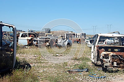 Old damaged cars in the junkyard. Car graveyard Stock Photo