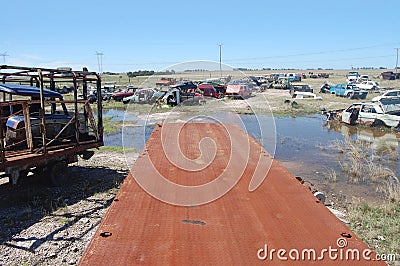 Old damaged cars in the junkyard. Car graveyard Stock Photo