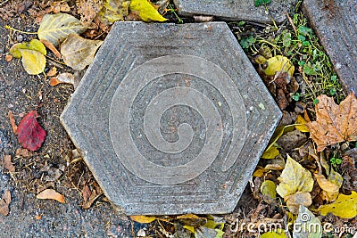 Old damaged hexagonal stone block pavement Stock Photo